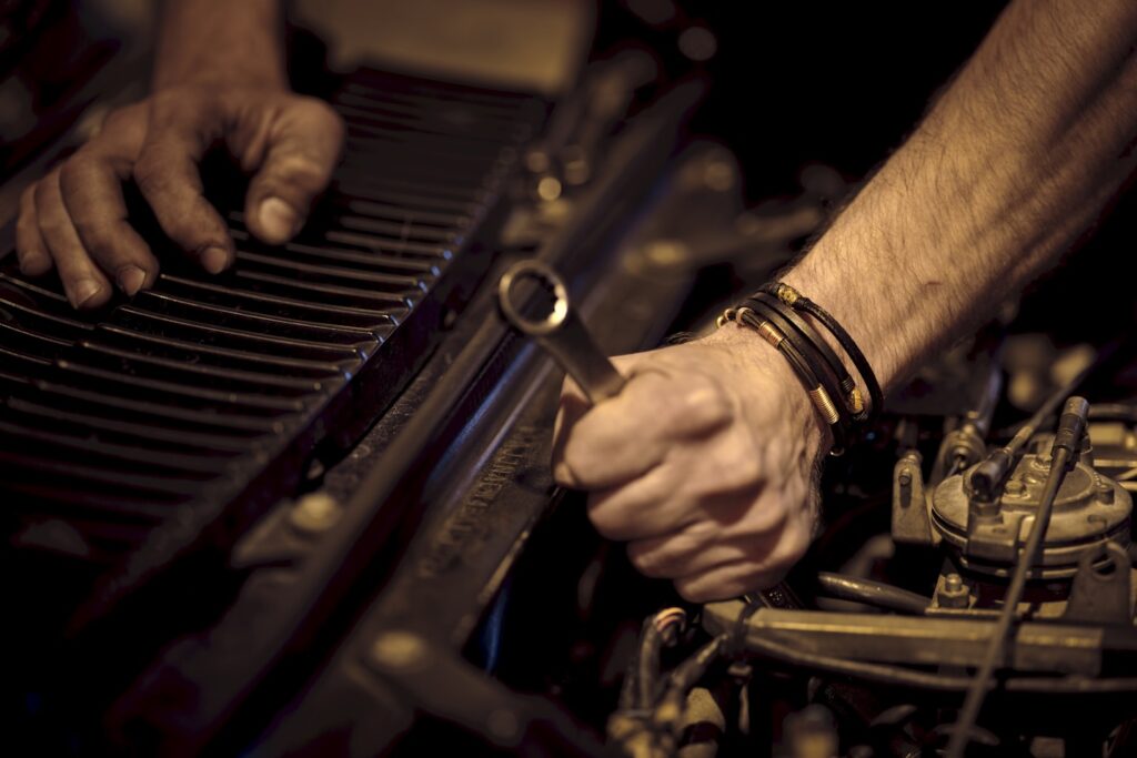 grayscale photo of person playing piano
